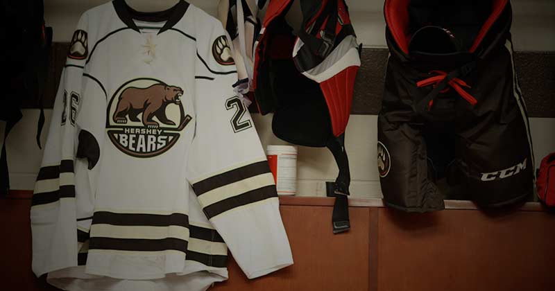 Bears jershey and equipment hanging in lockerroom
