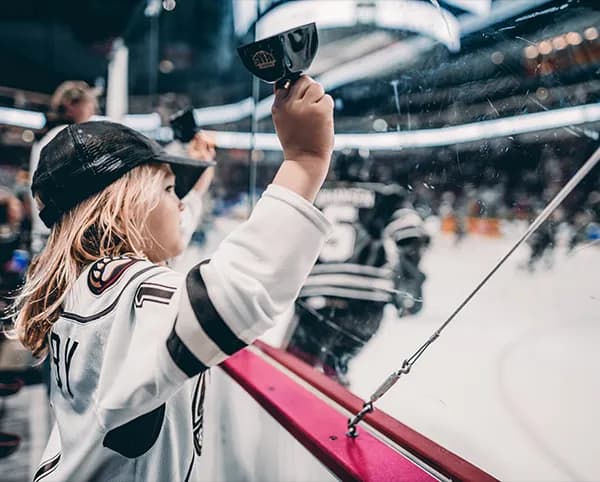 A child cheering on the Hershey Bears from the sidelines at GIANT Center.