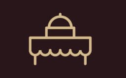 logo of a table with hot bar on it advertising catering options
