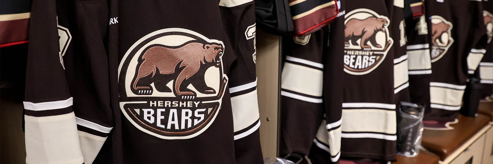 Bears jerseys in team locker room.