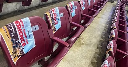Promotional giveaways resting on the seats inside GIANT Center.