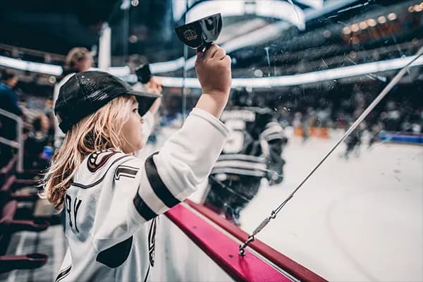 A young Hershey Bears fan cheering on the team from the sidelines at GIANT Center.