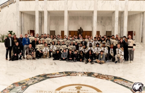 Hershey Bears players at Milton Hershey School with high school hockey players