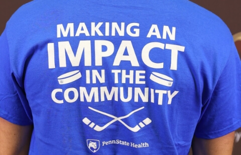 Hershey Bears player wearing Making An Impact In the Community t-shirt