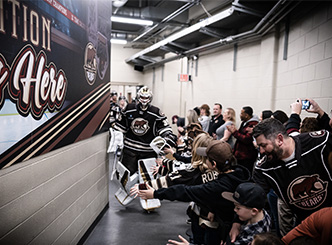 group high fiving Bears in the tunnel