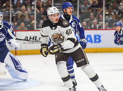 Mother and son cheering on the Bears
