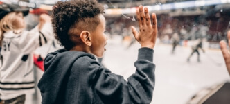 Child watching Hershey Bears game