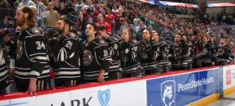 Hershey Bears players standing during national anthem