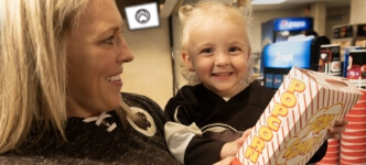 Child holding popcorn Hershey Bears concessions stand